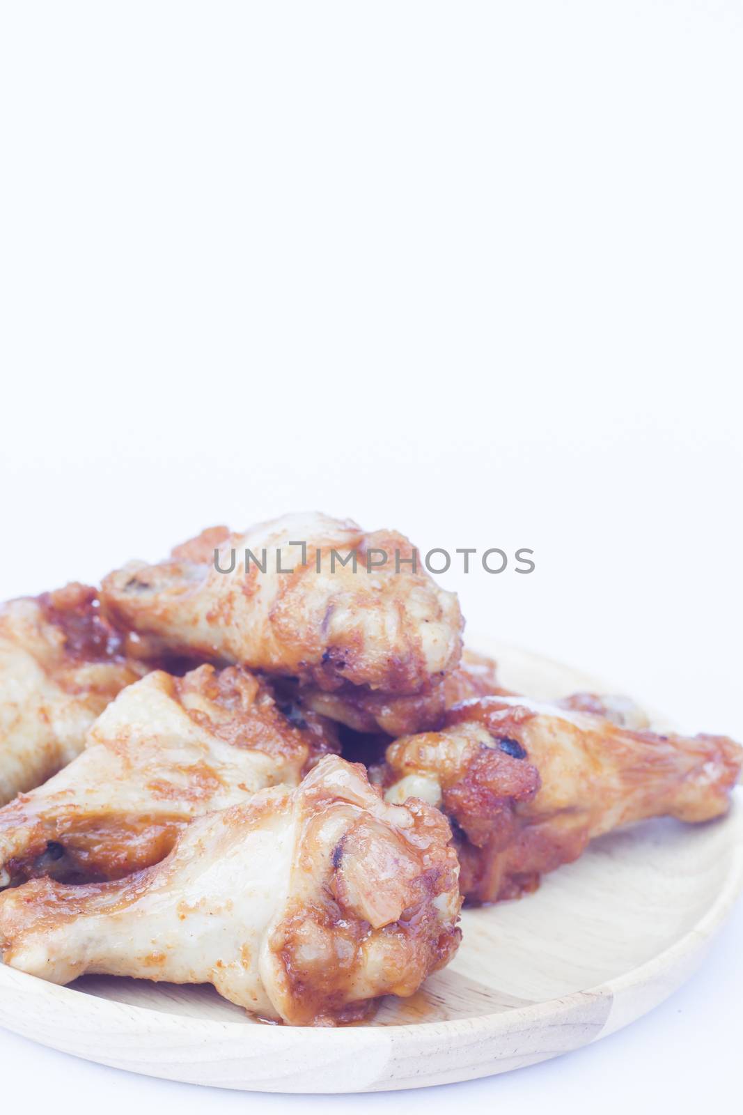 Grilled chicken wings isolated on white background, stock photo