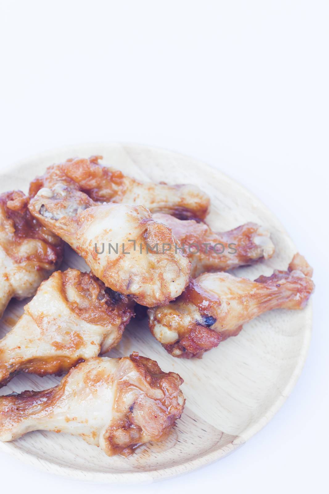 Grilled chicken wings isolated on white background, stock photo