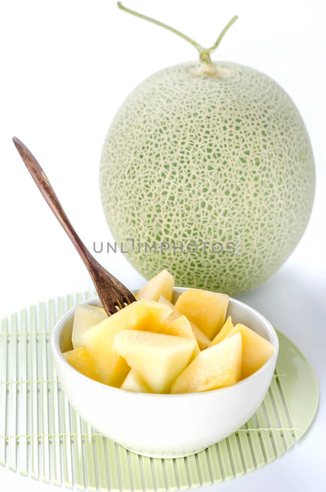 freshly cut cantaloupe melon on white background
