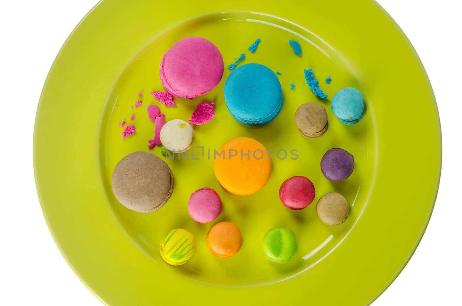 Colorful macaroons collection set on plate over white background