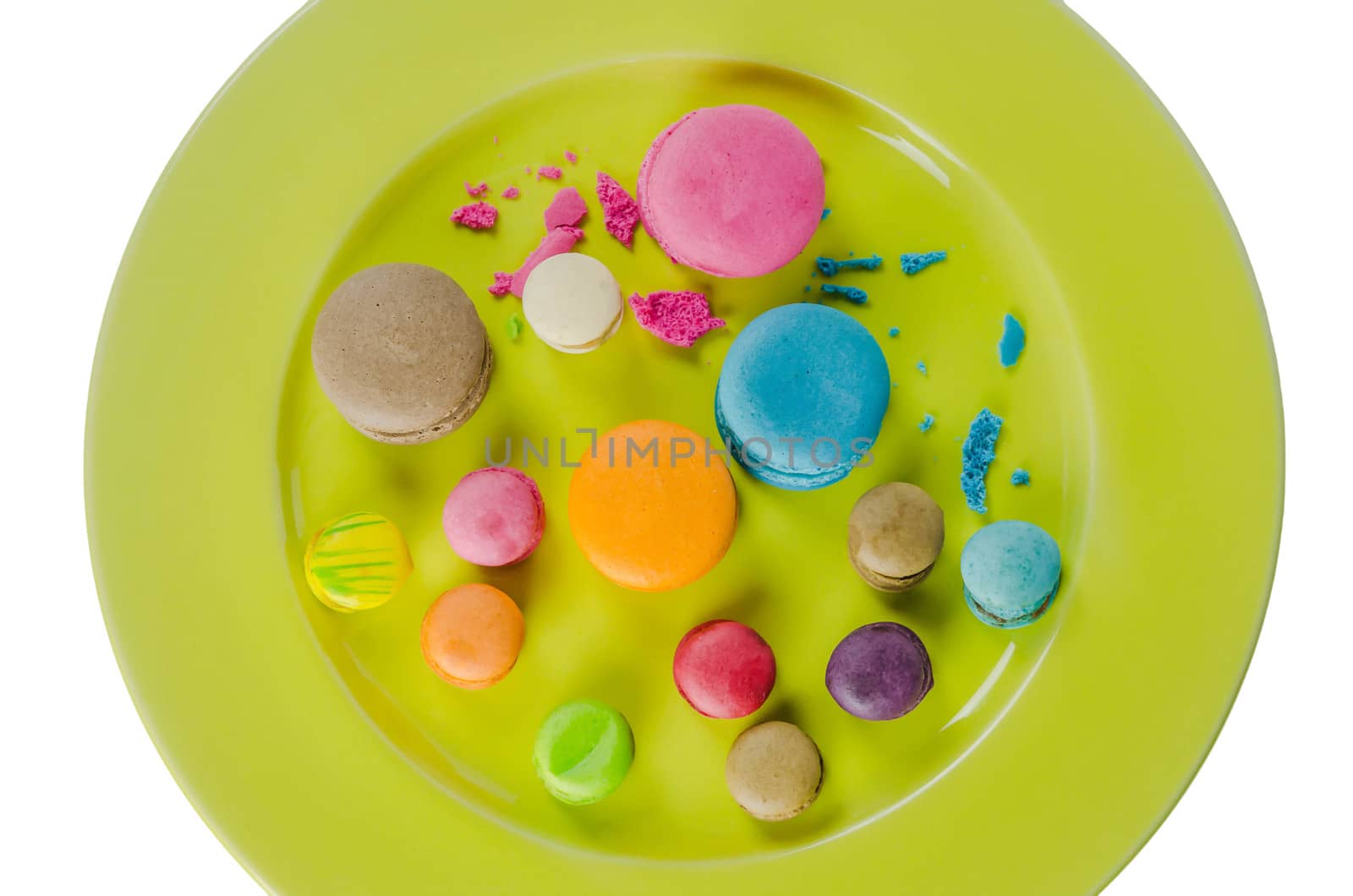 Colorful macaroons collection set on plate over white background
