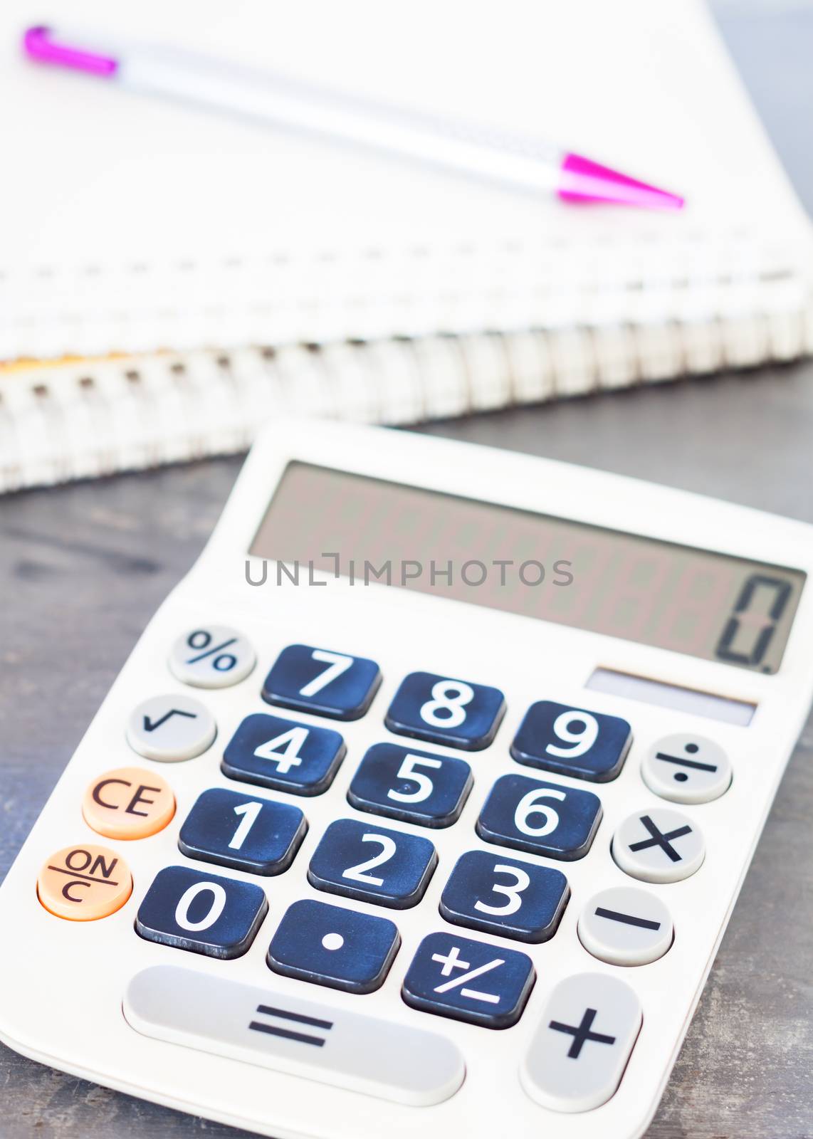 Calculator, pen and notepad for notes, stock photo