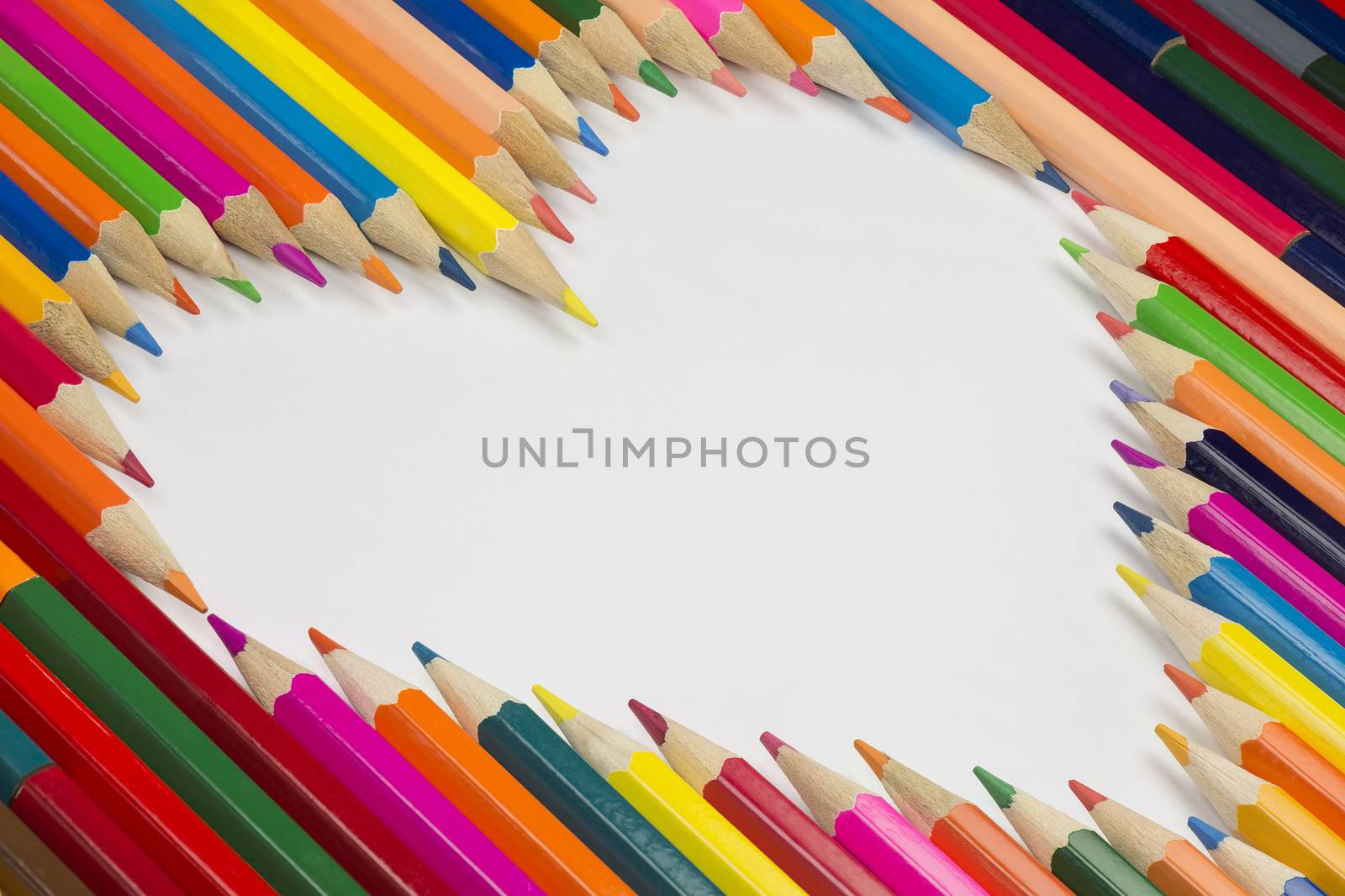 Collection of colorful pencils as a background picture in a heart shape
