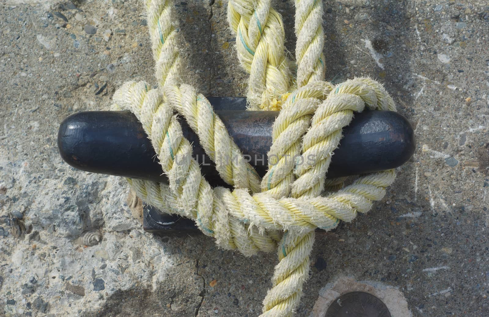 rope anchor boat dock concrete marina close up detail