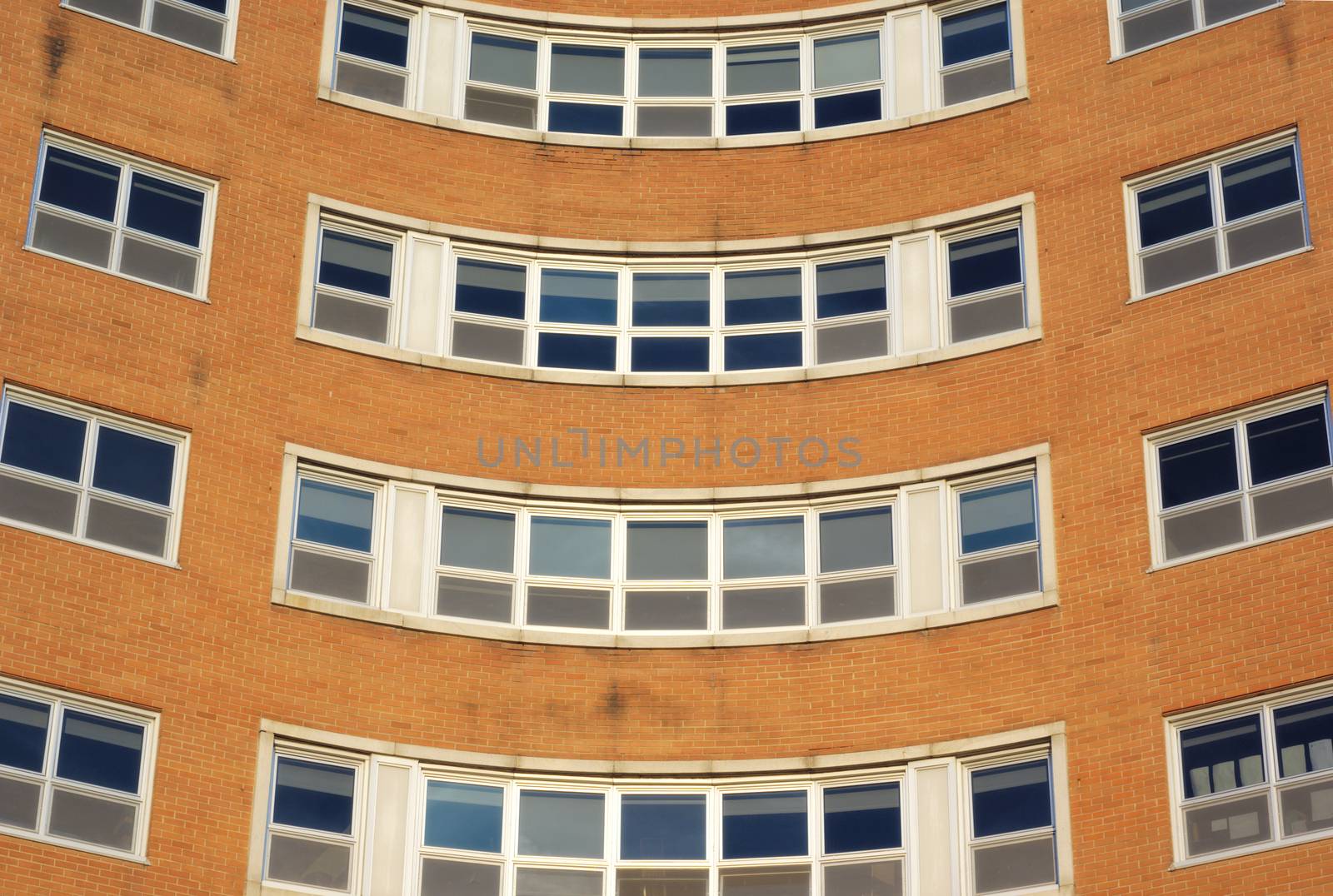 office building symmetrical windows brick and glass architecture office place of work