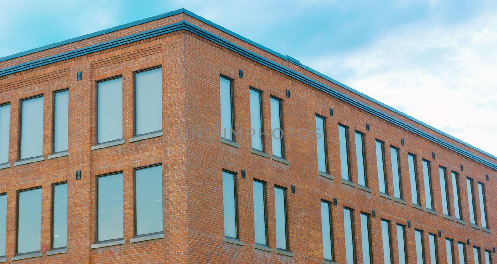 building top, red brick windows and sky perspective view wide horizontal