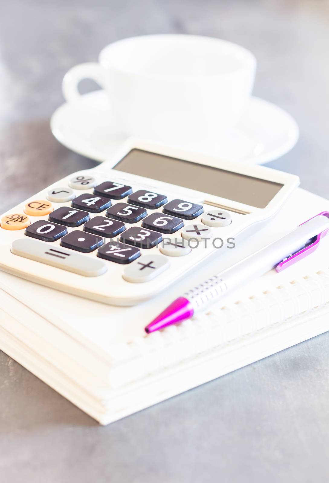 Calculator, pen and notepad for notes, stock photo