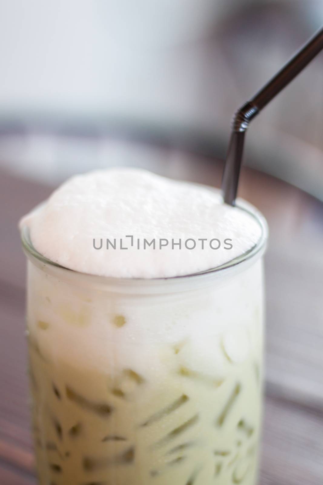 Iced green tea with microfoam, stock photo