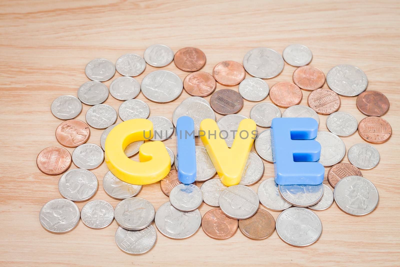 Give alphabet with various US coins, stock photo