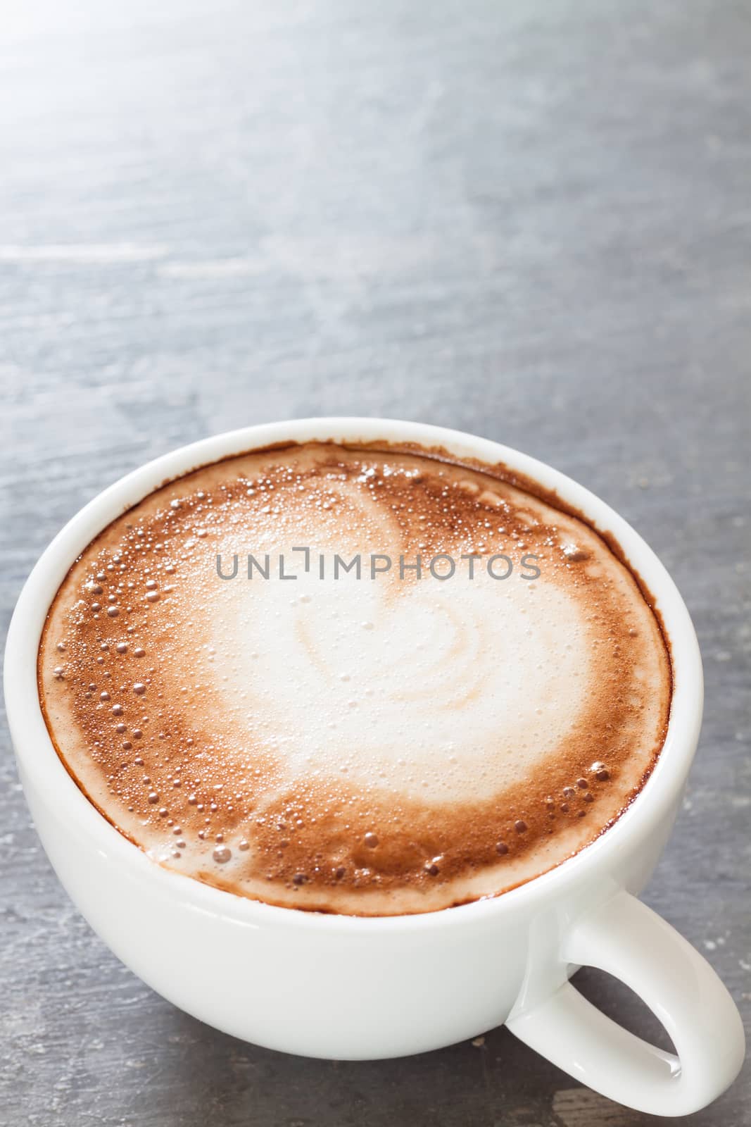 Coffee cup on grey background, stock photo