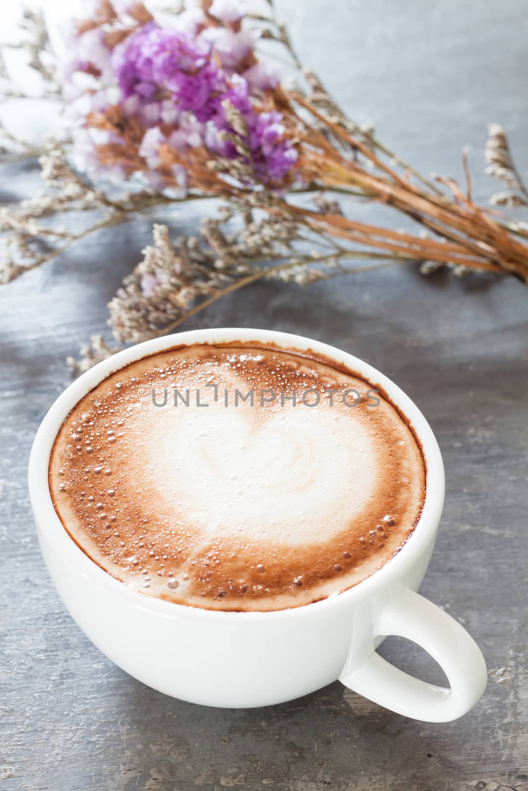 Coffee cup with beautiful violet flower by punsayaporn