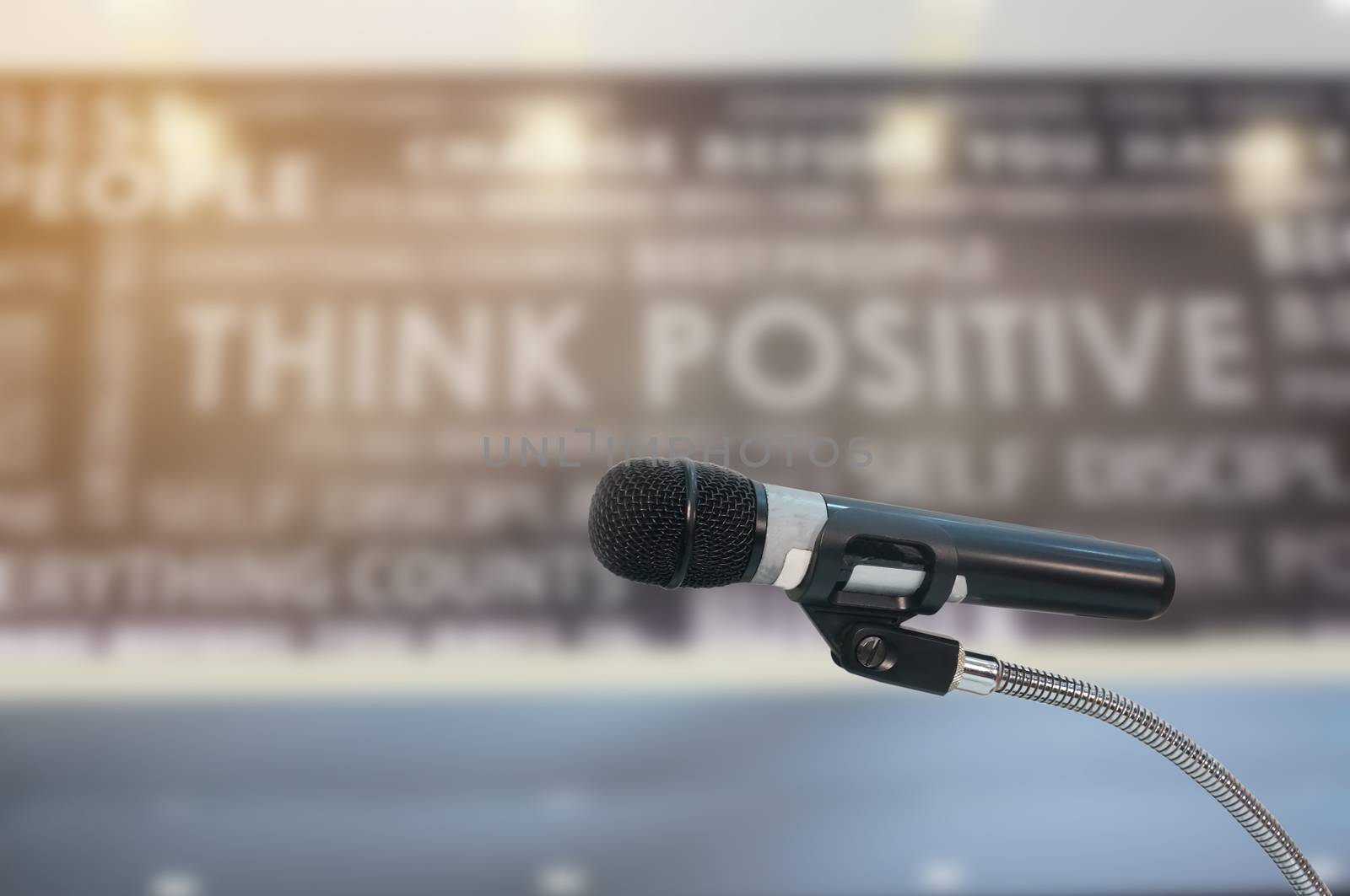                   microphone in  hall with lights in background. with 
extremely shallow dof.            