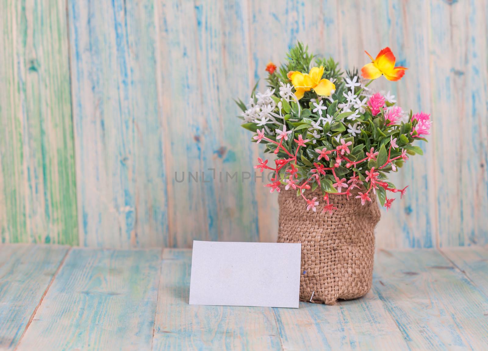 Bouquet of flowers with blank paper tag
