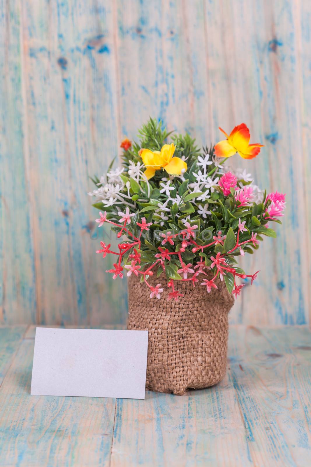 Bouquet of flowers with blank paper tag