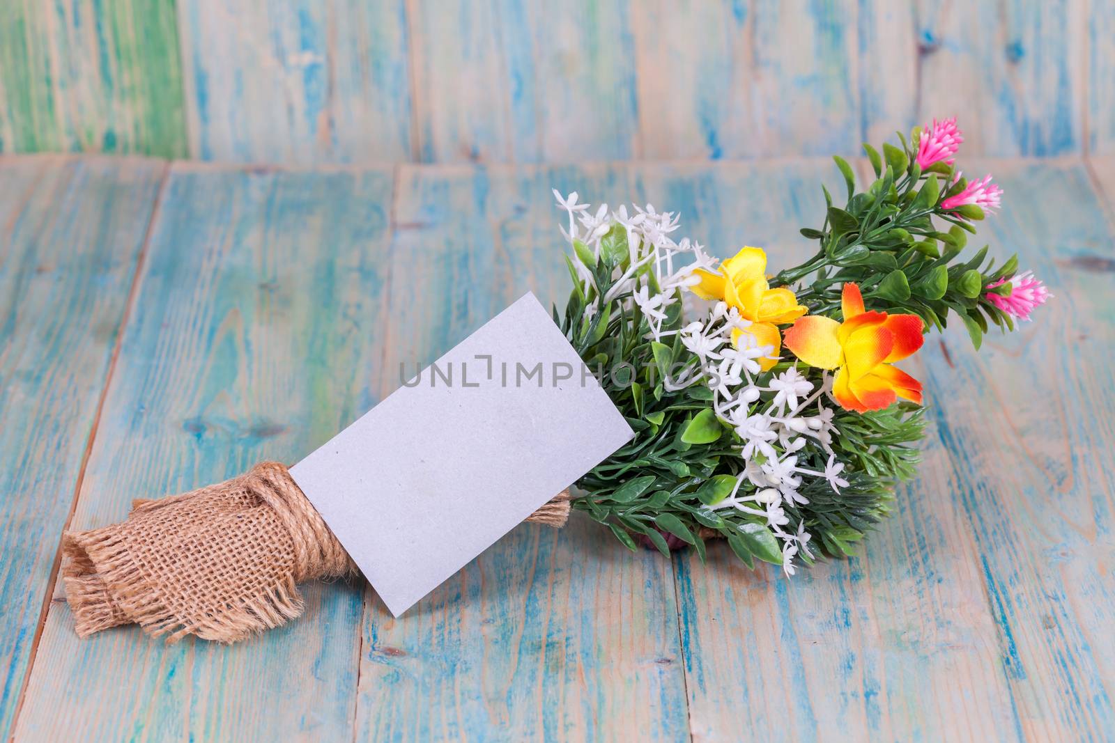 Bouquet of flowers with blank paper tag