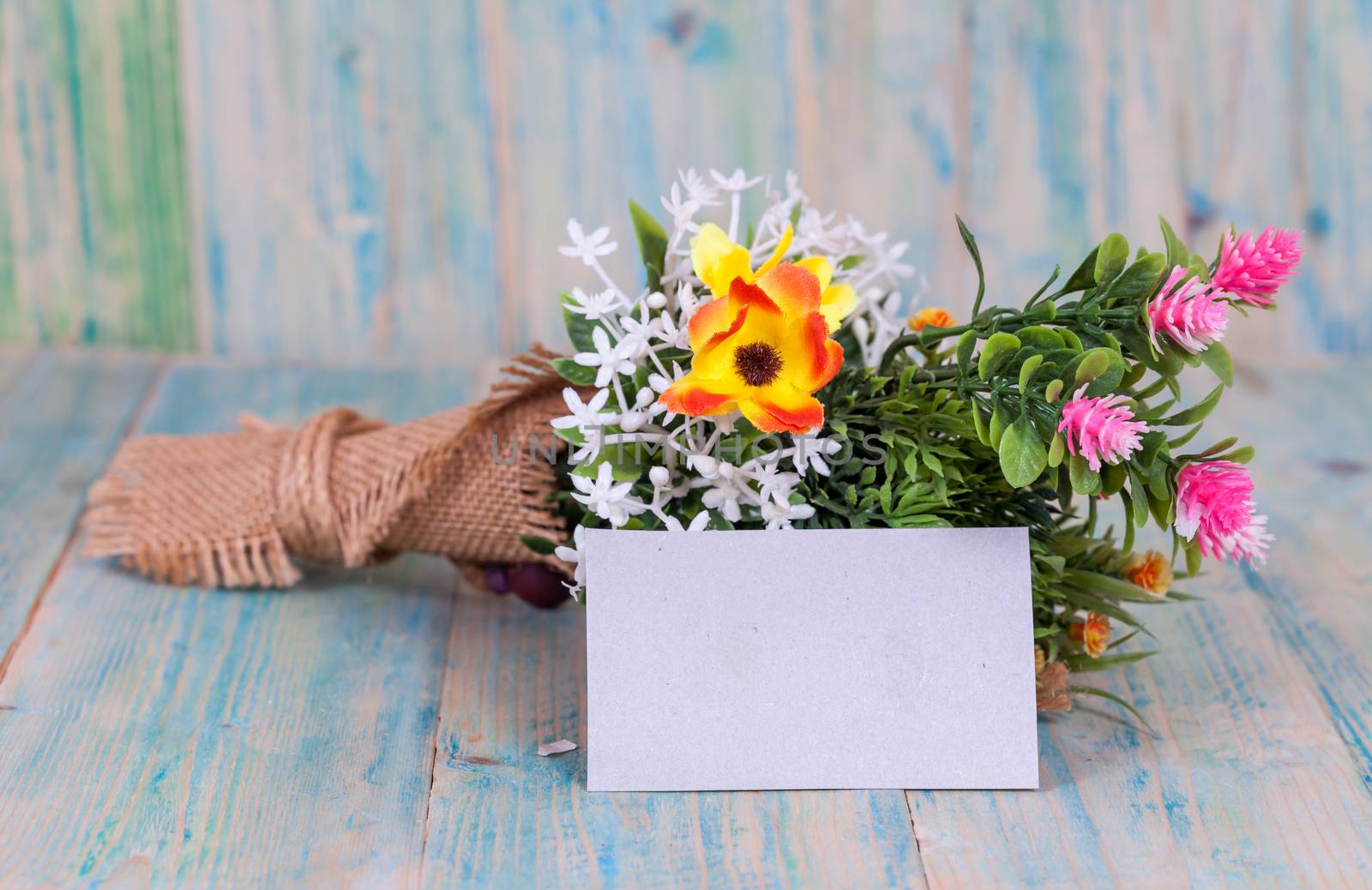 Bouquet of flowers with blank paper tag

