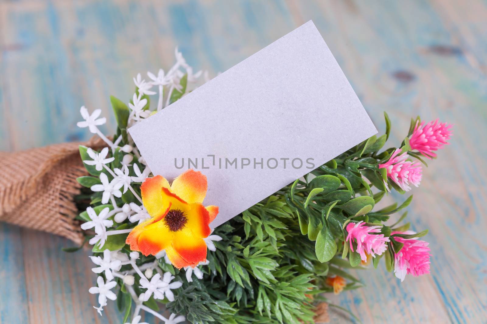 Bouquet of flowers with blank paper tag