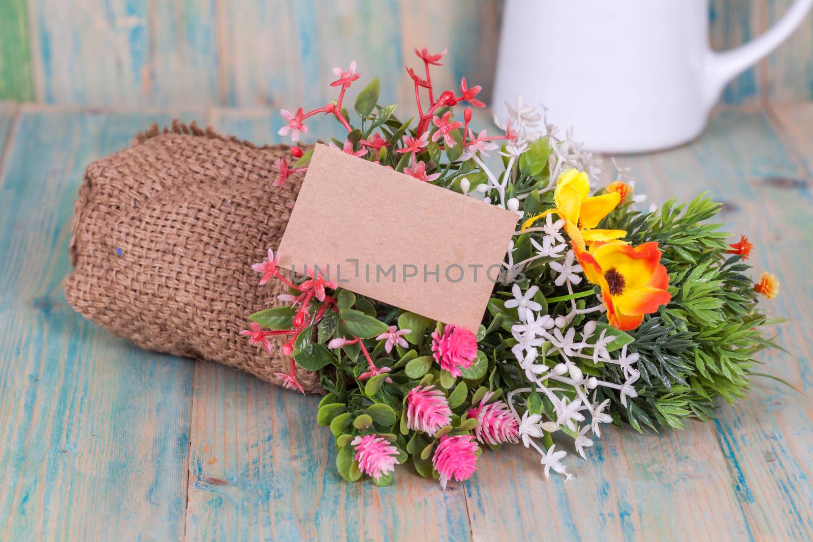 Bouquet of flowers with blank paper tag