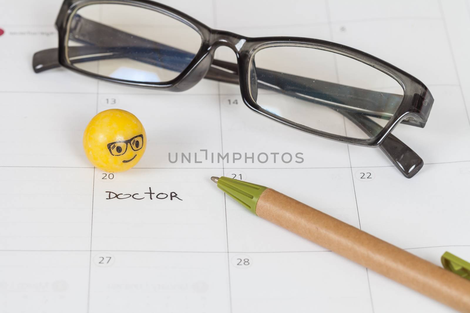 The words Doctor written on a Calendar to Remind you an Important Appointment
