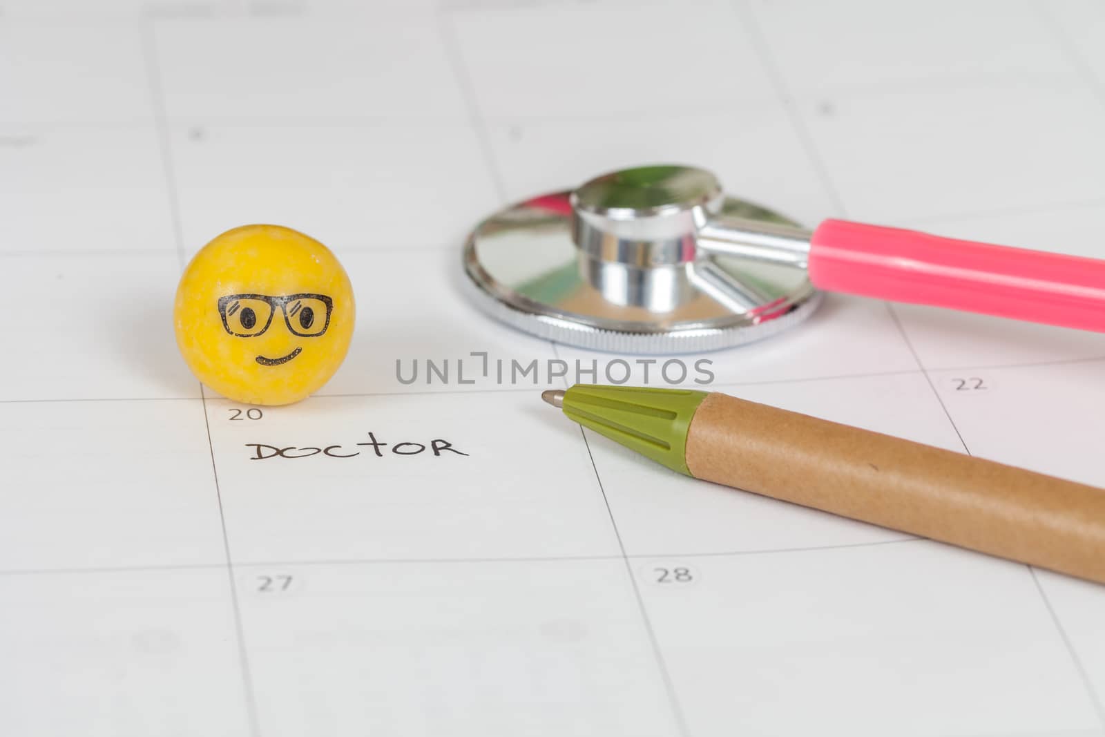 The words Doctor written on a Calendar to Remind you an Important Appointment
