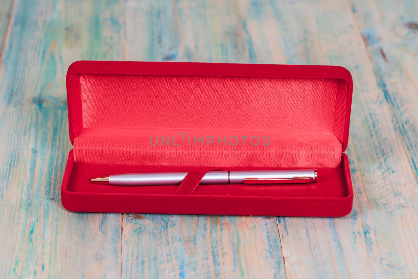 pen in red box cover
