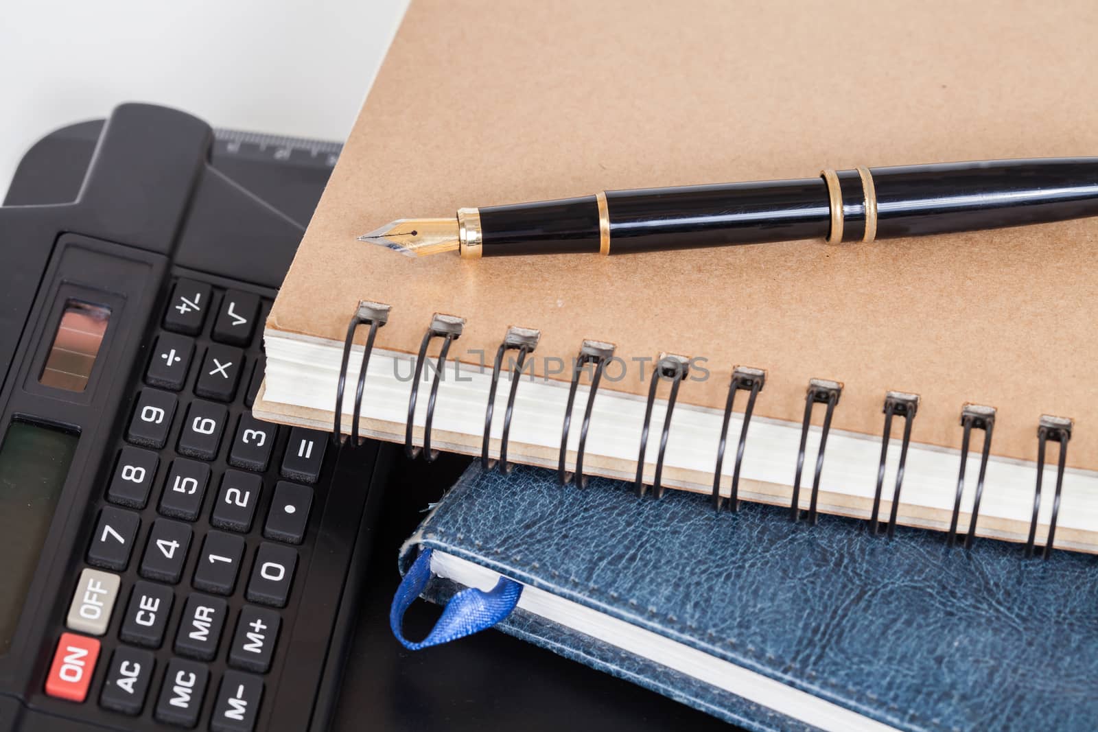 Diary with  pen  on white background