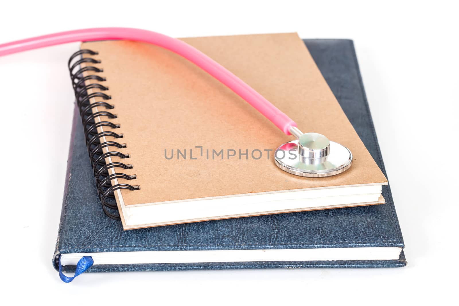 Diary  and stethoscope isolated on white background