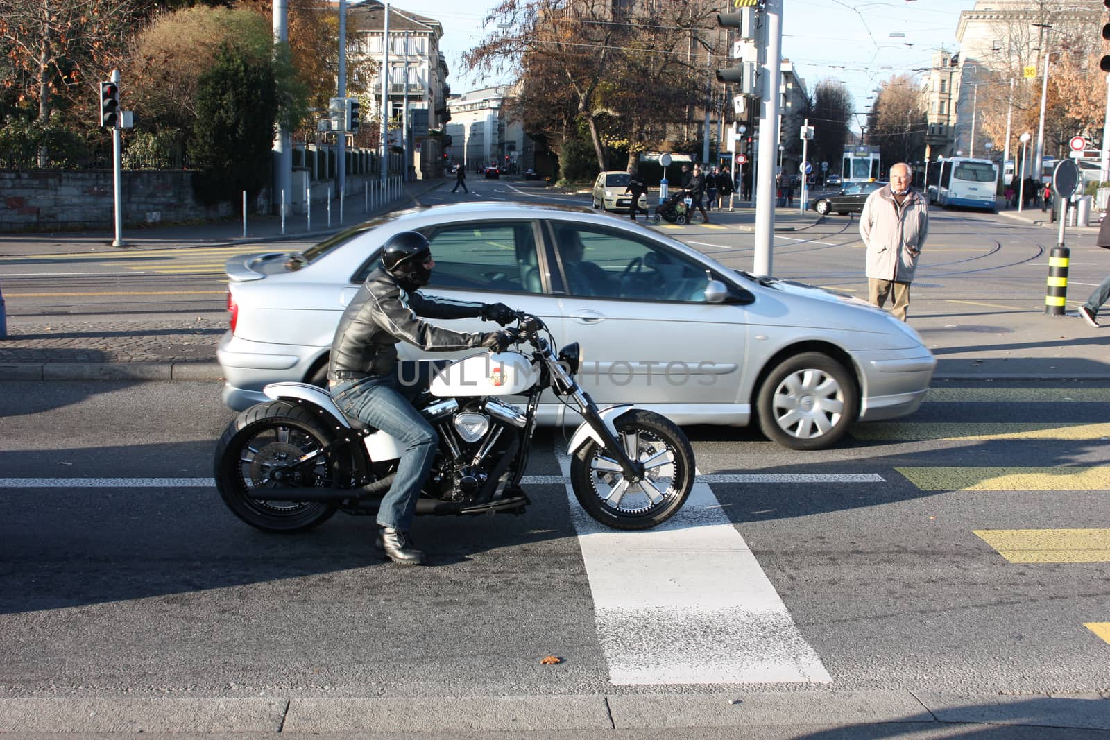 Motorcyclist biker stopped at an intersection by AndrewBu