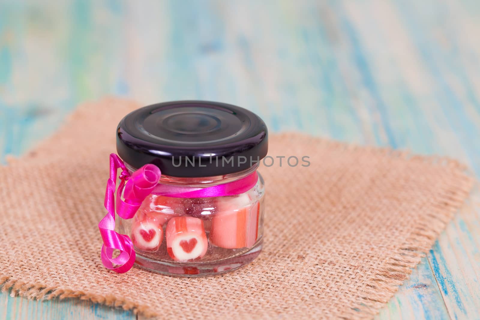 candies sweets heart in bottle on table