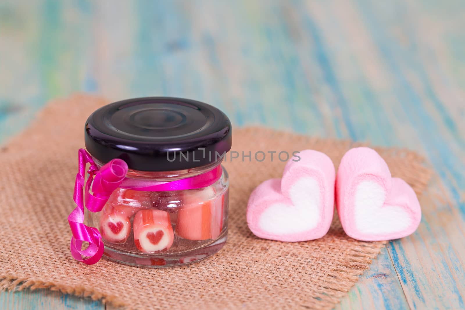 candies sweets heart in bottle on table