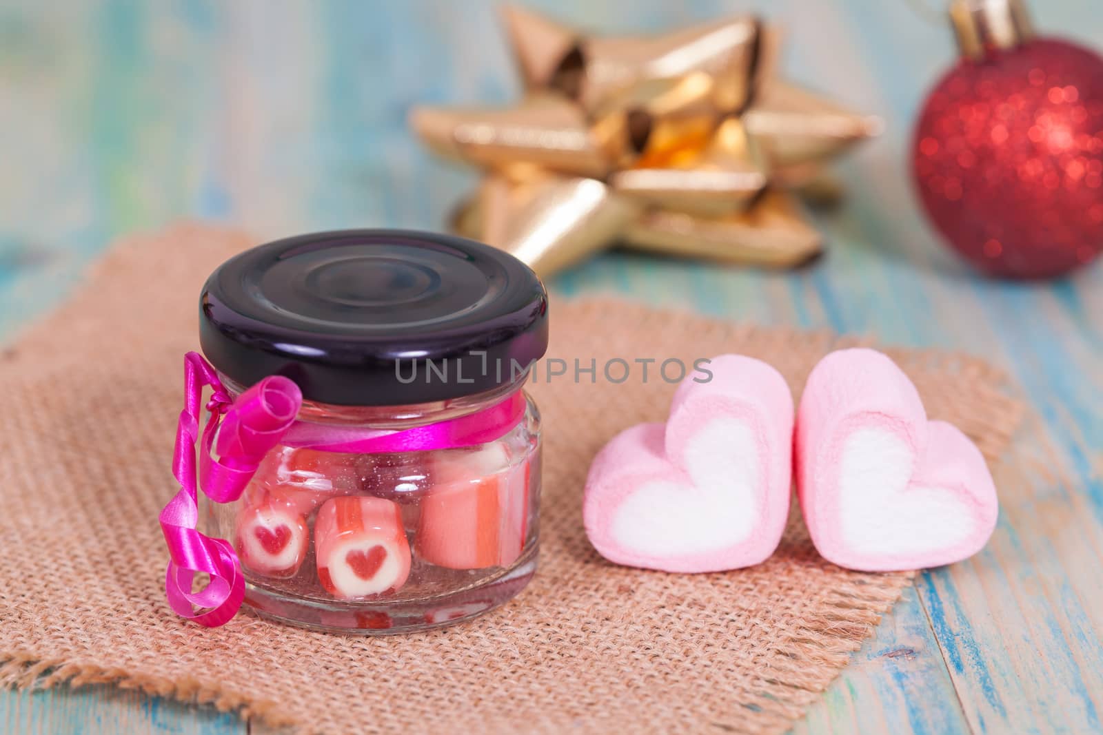 candies sweets heart in bottle on table
