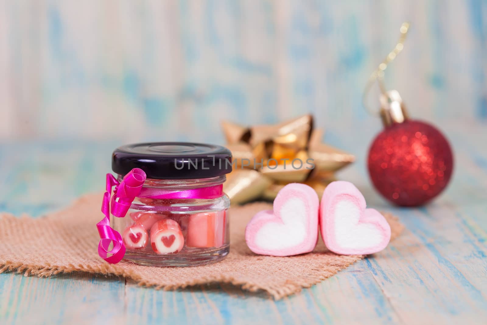 candies sweets heart in bottle on table
