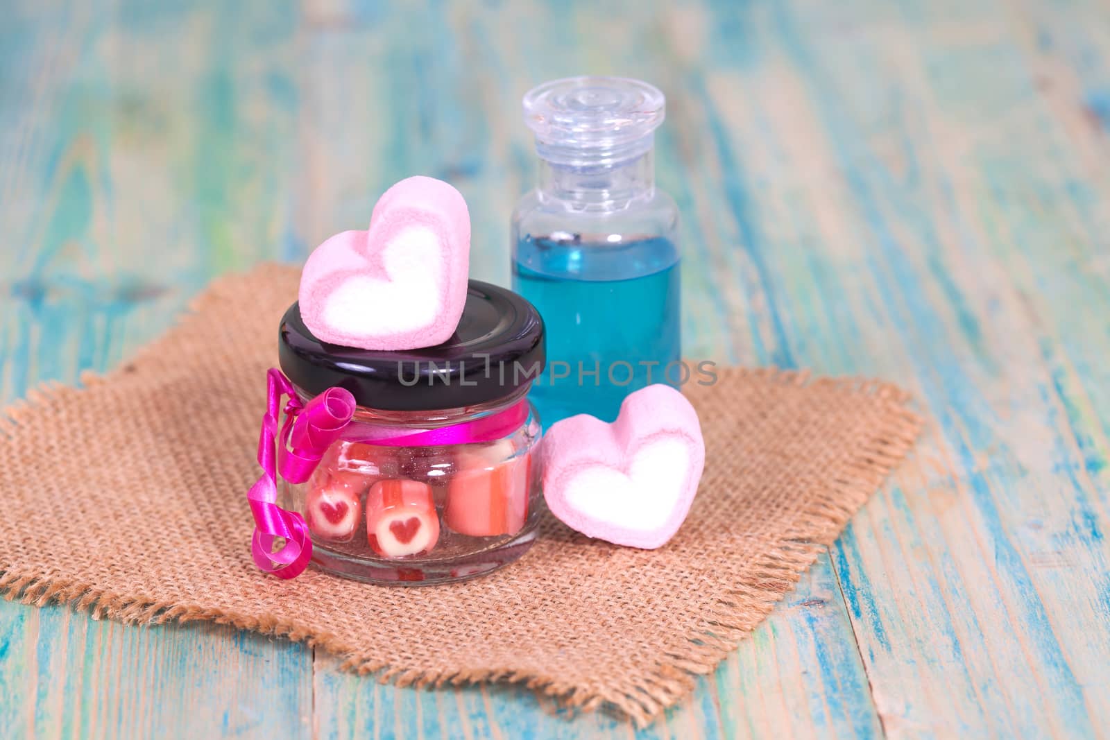 candies sweets heart in bottle on table