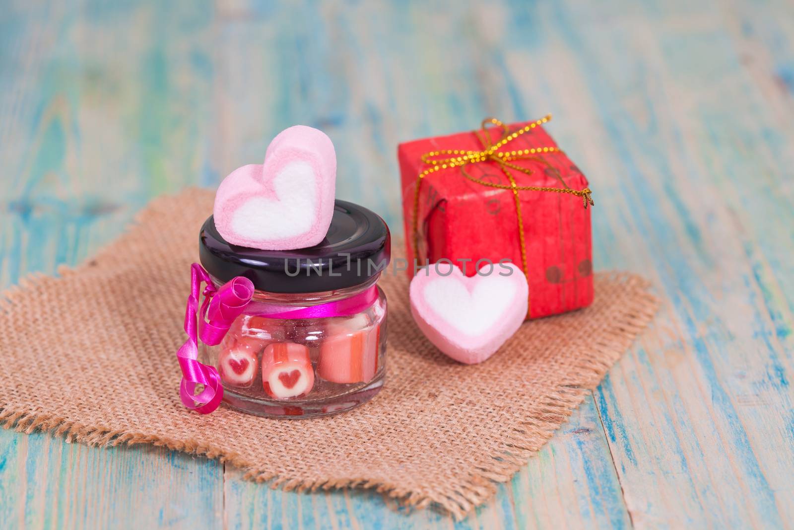 candies sweets heart in bottle on table
