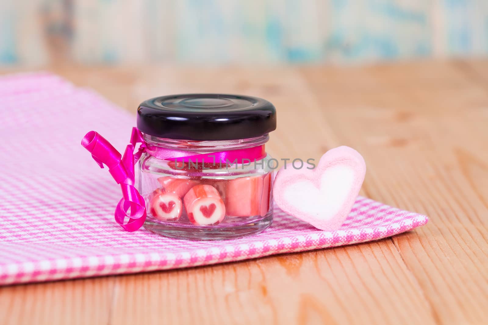candies sweets heart in bottle on table