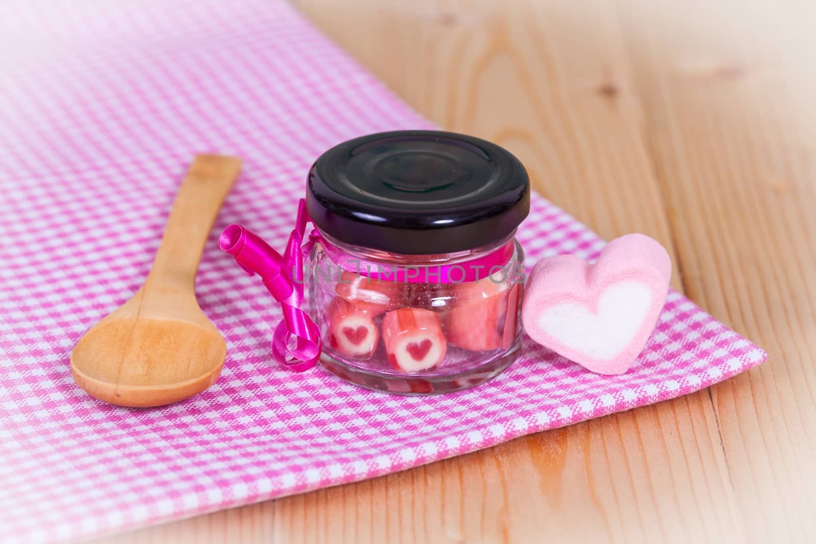 candies sweets heart in bottle on table