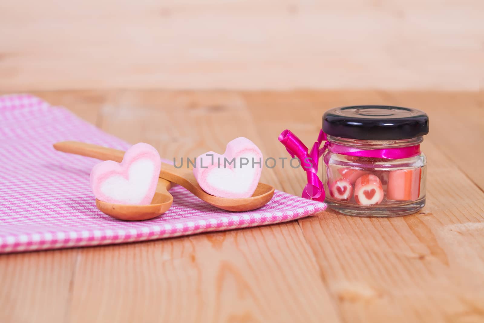 candies sweets heart in bottle on table