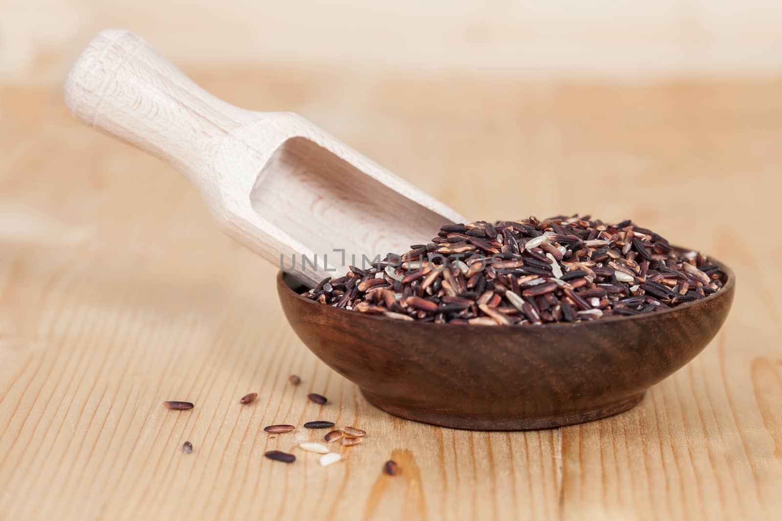 raw Rice berry on wood background