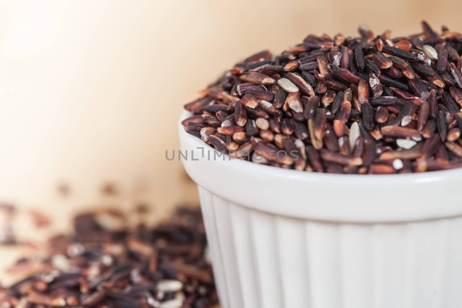 raw Rice berry on wood background