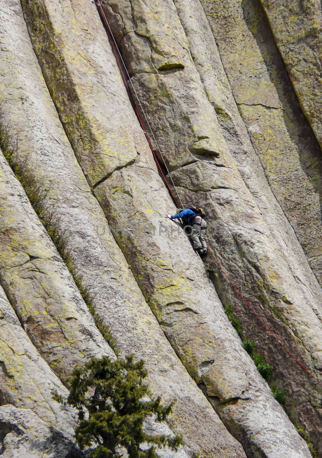 Mountain climber on Devils Tower in Wyoming by wit_gorski