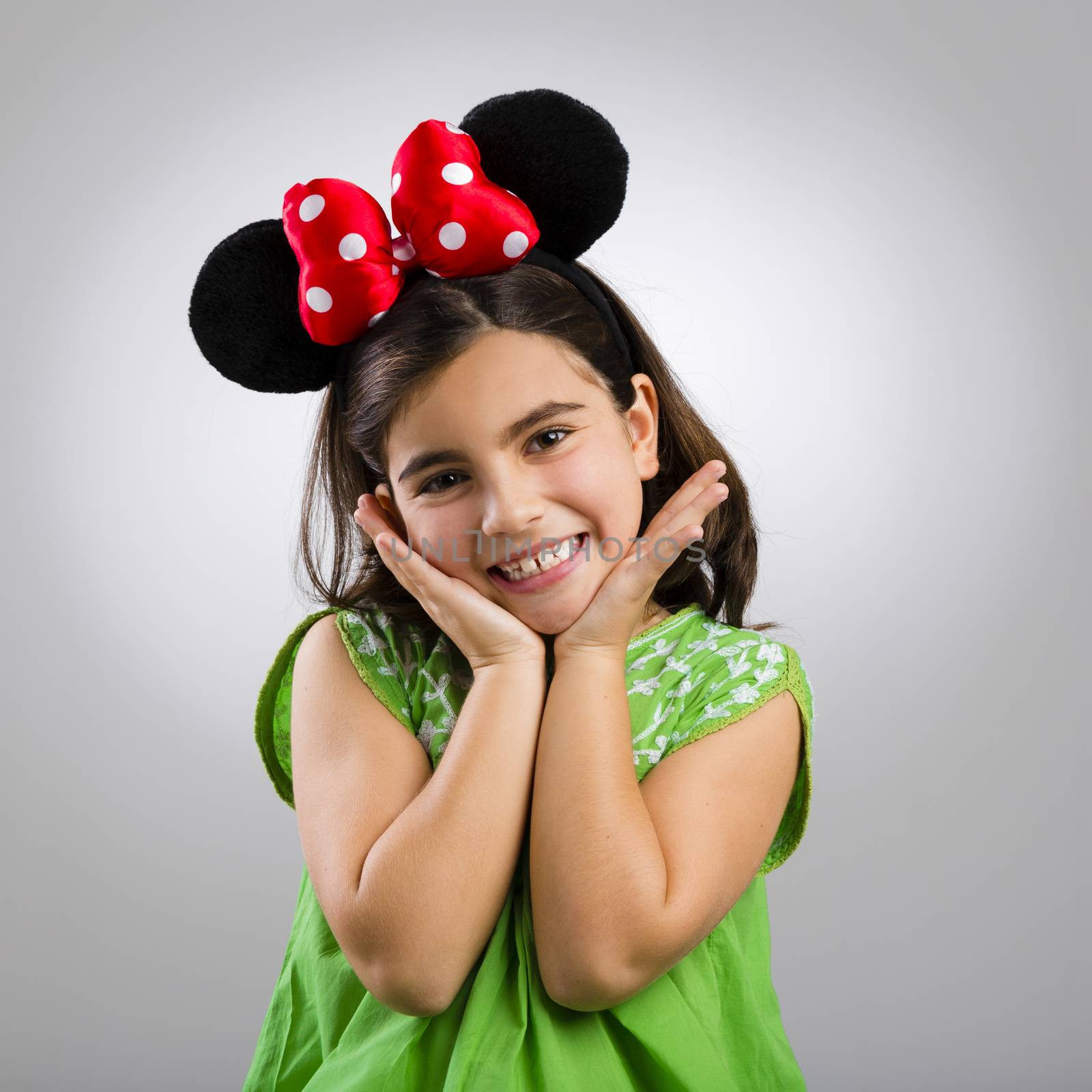 Studio portrait of a little girl with mouse ears