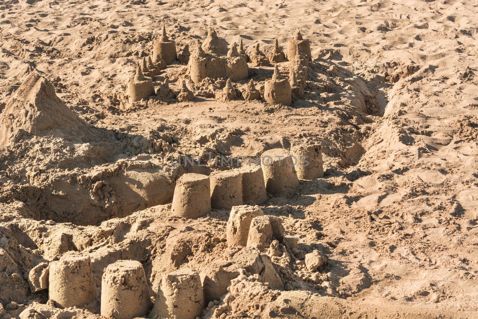 Closeup of a sandcastle on a sandy beach