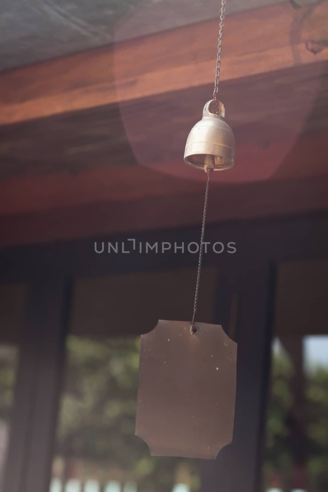 Bell hang on wooden roof, stock photo