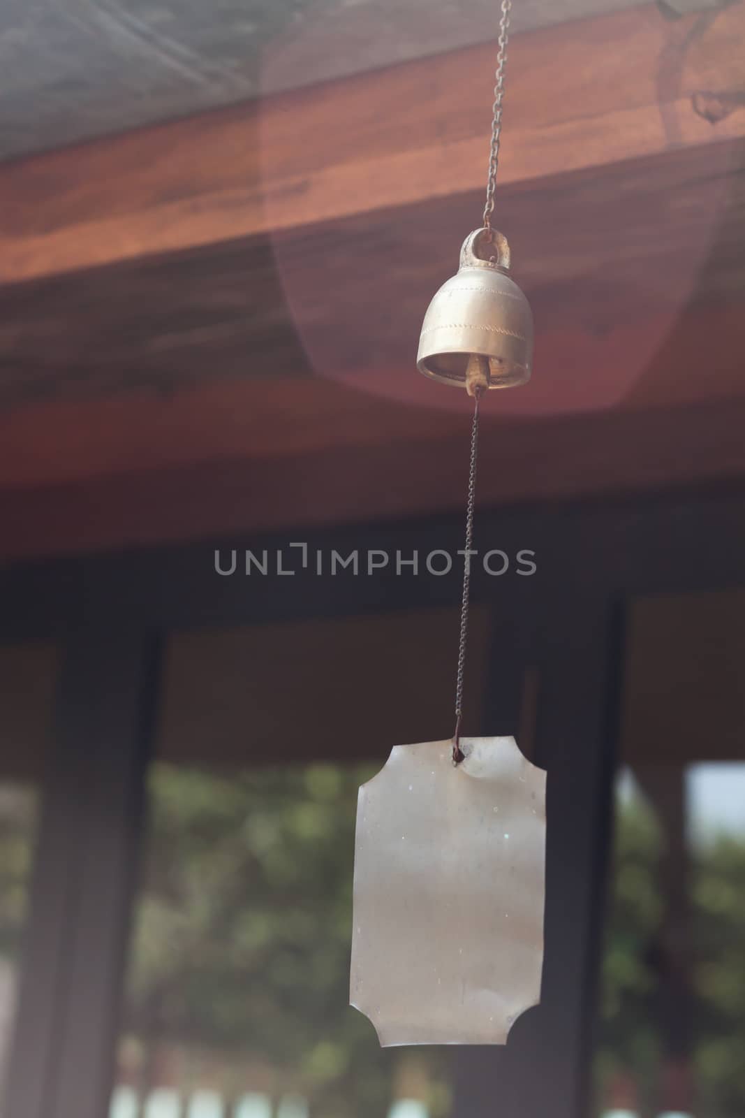 Bell hang on wooden roof, stock photo