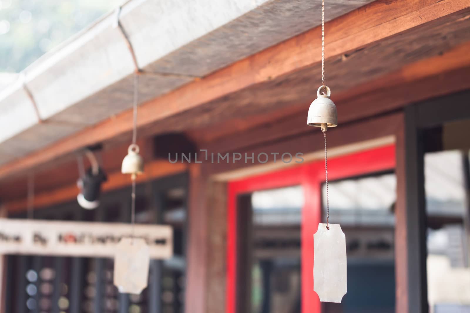 Bell hang on wooden roof, stock photo