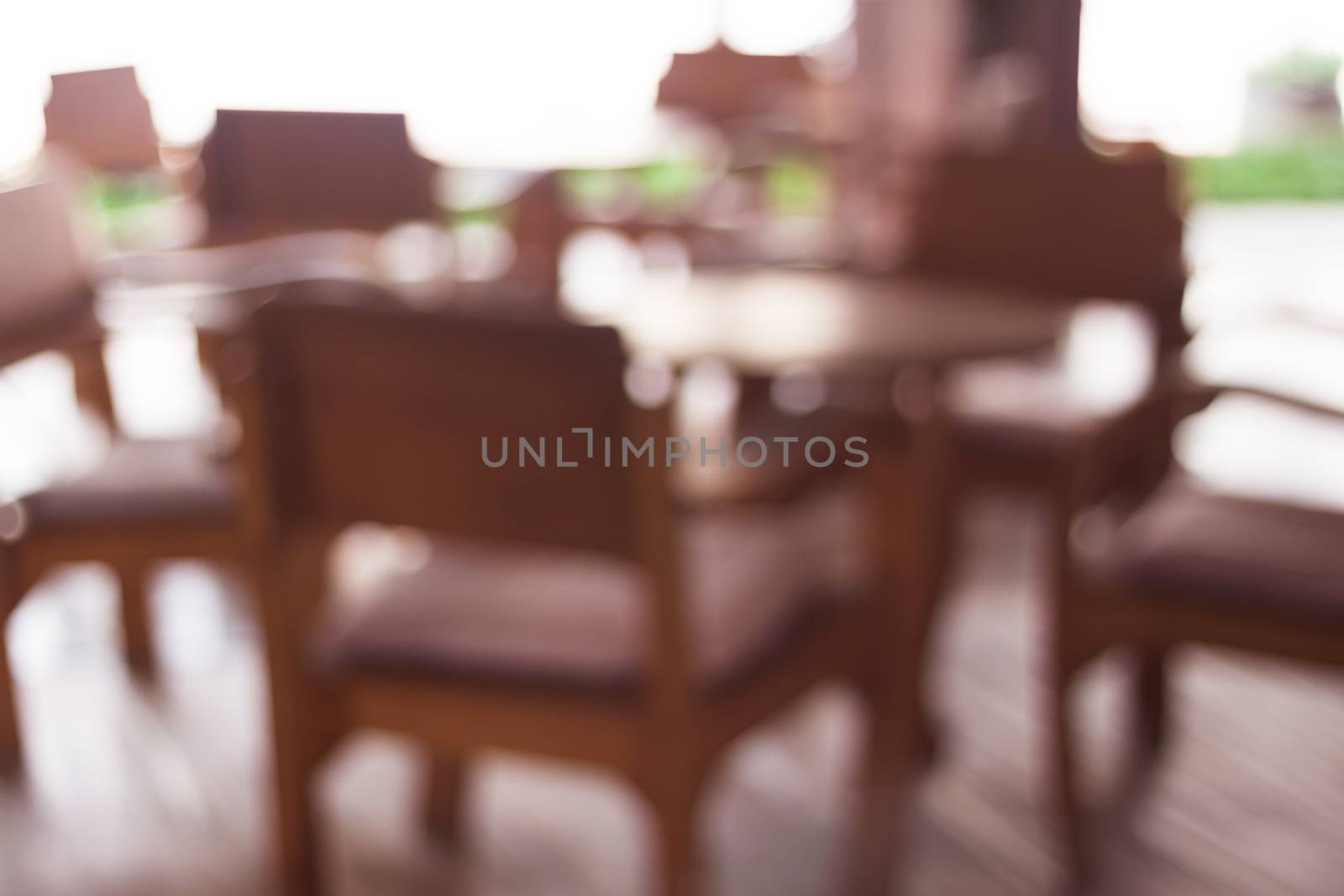 Coffee shop blur backgroun with wooden table, stock photo