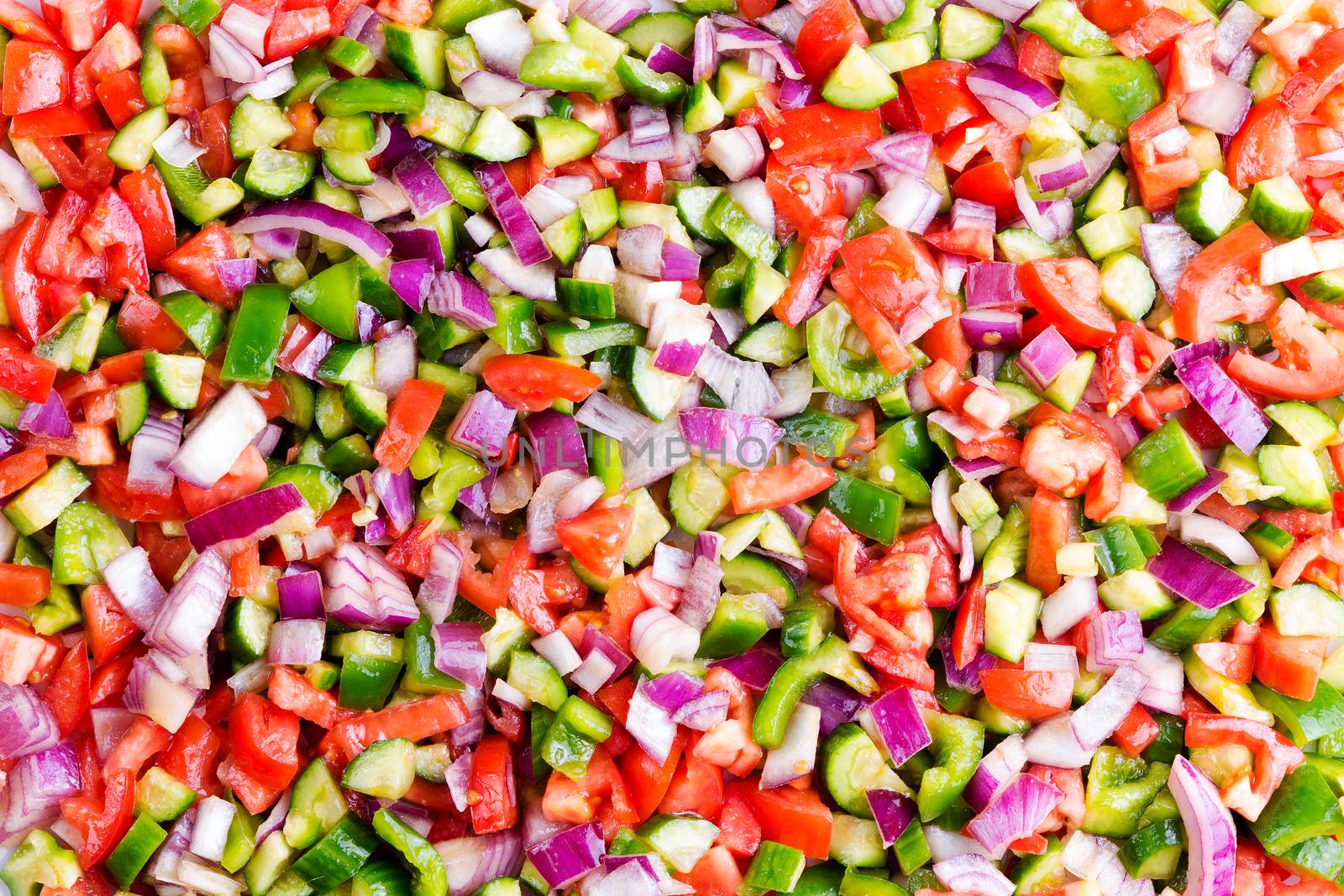 Food background of healthy Turkish shepherd salad in a full frame view of colourful mixed diced fresh vegetables viewed close up from overhead