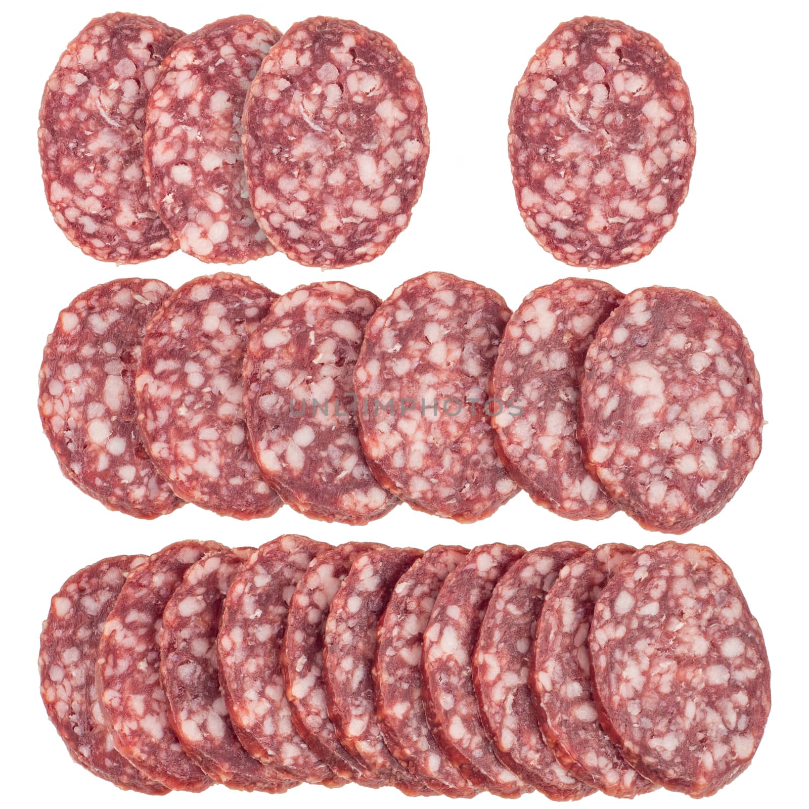 Slices of salami sausages isolated on a white background. Top view.