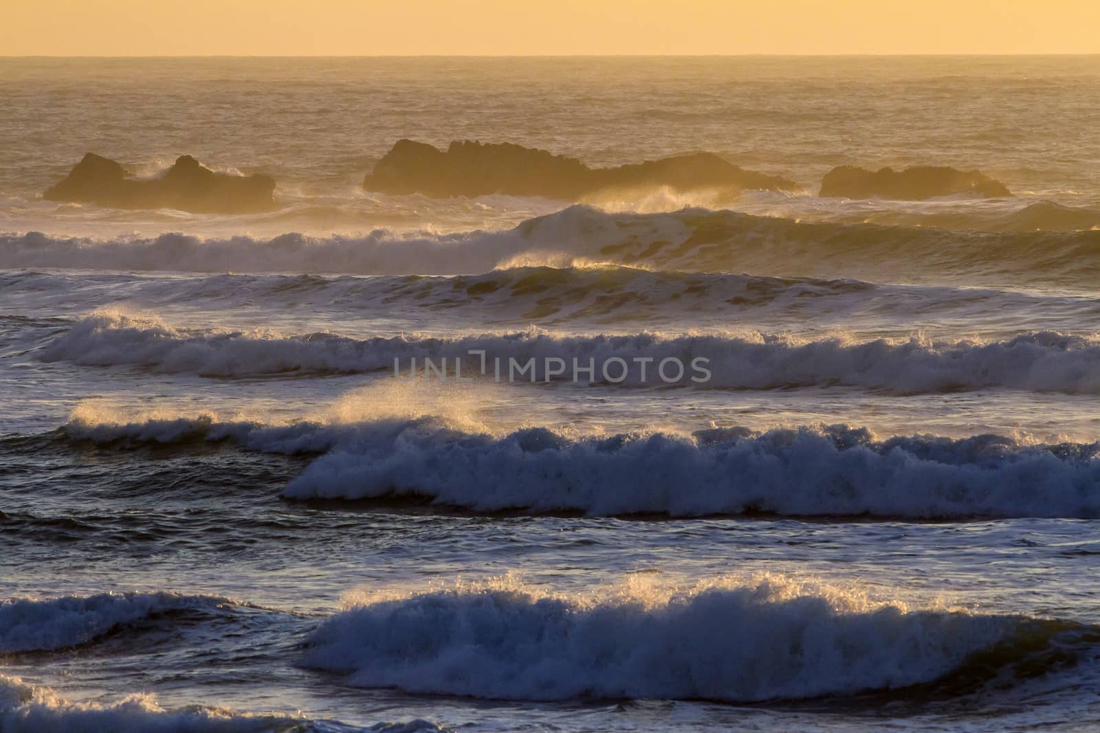 Colorful ocean waves at sunset in Chile