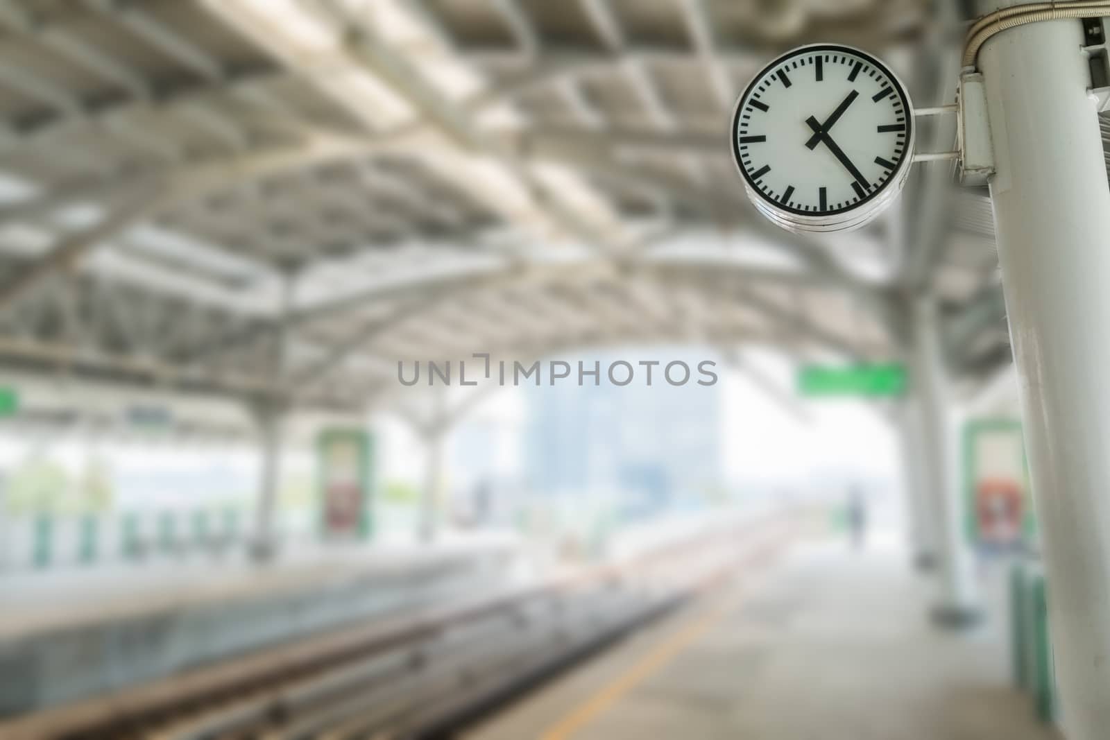 Clock on train station/effect blur background.